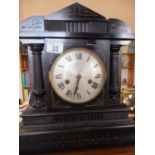 Ebonised mantle clock with an 8 day movement striking on a gong