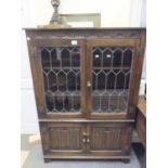 Oak 1940's glazed cabinet with lead glazed doors above 2 doors 5' tall x 3'6 wide, the top section