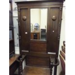 c1900 Edwardian period oak hallstand, umbrella section to the base with a seating area, all below