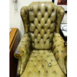 Leather button backed swivel gentleman's chair, in a shabby condition, 1 caster needs re-screwing,