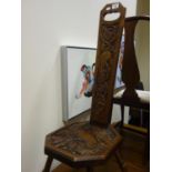 Arts & Crafts period carved hall chair, the seat decorated with a carving of a Bird among trees,