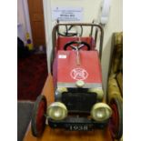 Children's foot pedal model of a 1938 Red Fire Engine, with chrome highlights, in general good