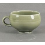 Bernard Howell LEACH (British 1887-1979) Celadon glazed porcelain cup, the base incised with