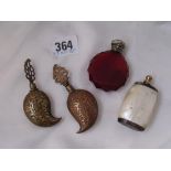 Ruby glass scent bottle with silver cover and three metal examples