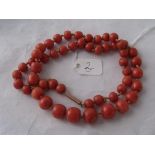 A single row of graduated coral beads with 9ct clasp 43g inc