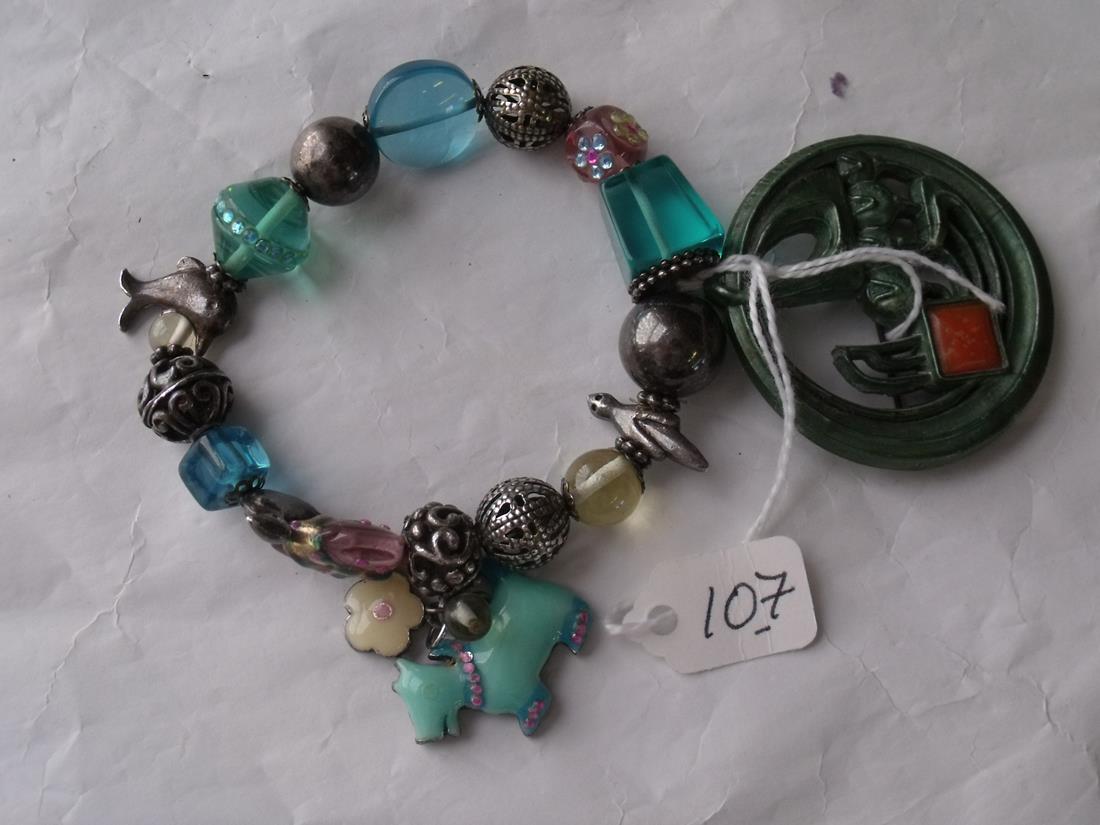 A metal & glass bead bracelet and an Art Deco stone set brooch