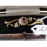 An amethyst and pearl gold mounted antique bar brooch in fitted box
