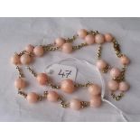 A good 18ct gold mounted coral bead necklace 23” long weighing 24.2g inc