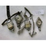 Bag containing ladies metal wrist watches