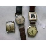 Two gents tank cased metal wrist watches and 2 more