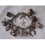 Silver charm bracelet set with numerous charms 62.1g
