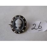 A small Georgian hardstone mourning brooch set with garnets & pearls having hair back glass panel