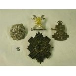 Four military badges