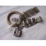 A Victorian silver child’s teething ring and two gate bracelets