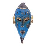 Early 20th century, Mali, Dogon painted male mask. A painted carved wood male mask of elongated