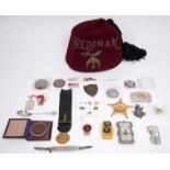 A collection of masonic and fraternal societies' badges and insignia. An American fraternal fez; a