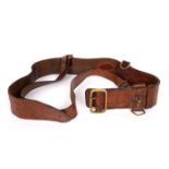Early 20th century Sam Browne belt. A brown leather Sam Browne belt with white metal buckle, of a