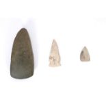 8th century AD polished stone axe head and two Clovis arrow heads. A gift from American