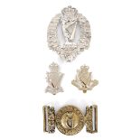 1881-1921 Royal Irish Rifles, other ranks waist belt clasp, a helmet plate and two cap badges