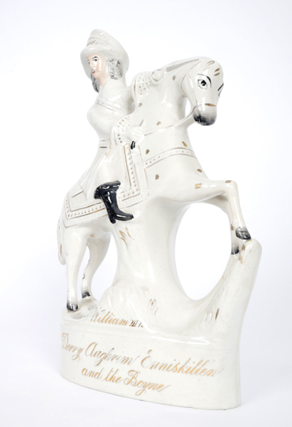 A 19th century Staffordshire figure of William III. The slip-cast figure depicting the King mounted,