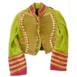 Irish Coachman's livery The short, hussar-style tunic of acid-green wool. Bullion corded front