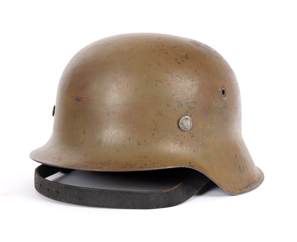 20th century steel helmet modelled on the German M35 helmet. The shell stencilled with Afrika