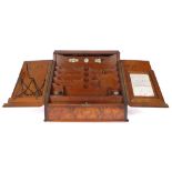 Victorian walnut stationery cabinet A burr-walnut slope front stationery cabinet, having a pair of