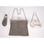 Early 20th century silver purses. An early 20th century silver chain-link purse, Birmingham, 1918; a