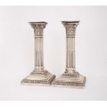 A pair of Victorian silver candlesticks. A pair of Victorian silver Corinthian columnar