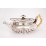 George IV silver teapot. An early 19th century silver teapot of squat-melon form, the ivory c-shaped