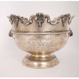 A George IV silver Monteith. Of heavy gauge, the scalloped rim with relief scroll border, over