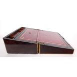 A Victorian rosewood writing slope. A brass-inlaid rosewood lap-desk, the interior with gilt-