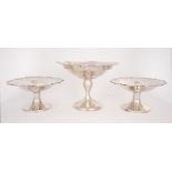 A pair of George V silver sweetmeat dishes and another. A pair of 1930s silver sweetmeat dishes, the