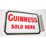 Enamel sign, Guinness. A rectangular two-sided sign, the white background with green and black