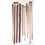 Collection of walking canes, riding crops and swagger sticks. A silver mounted blackthorn, a walking