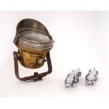 Two Jaguar mascots and a brass motorcycle headlight. A brass motorcycle headlight by Miller;