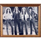 Thin Lizzy, photograph signed by all four band-members. 1978. A black and white publicity photograph