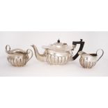 Edwardian silver bachelor tea set. An early 20th century, silver, three-piece 'bachelor' tea-set,