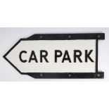 Road sign, 'Car Park'. A cast alloy finger sign, the relief text in black. 11 by 26in. (27.9 by