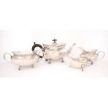 Edwardian silver tea service. An early 20th century silver three-piece tea service, a band of