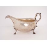 Edwardian silver sauce boat. An Edwardian silver helmet-shaped sauce boat, by Mappin and Webb, the