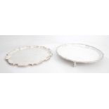 Two 20th century silver trays. A silver circular tray the moulded rim enclosing a plain reserve on