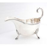 George V silver sauce boat. An early 20th century silver sauceboat, the gadrooned rim over plain