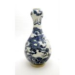 A Chinese blue and white porcelain garlic-mouth bottle vase. Dercorated in underglaze blue with a