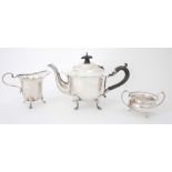 Early 20th century harlequin silver three-piece bachelor tea service. The teapot, Birmingham,