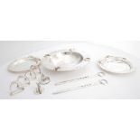 A collection of Irish silver equestrian-themed wares. A pair of waiters mounted with polo mallets,