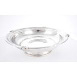 Art Deco silver bowl. A circular silver bowl, the moulded rim with four cast mounts, on circular