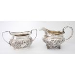 George IV silver jug. An early 19th century silver milk jugThe gadrooned rim over repousse floral