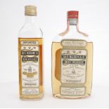 Two 4/5 pint bottles of Old Bushmills Irish Whiskey. A 1930s 4/5 pint bottle of Old Bushmills