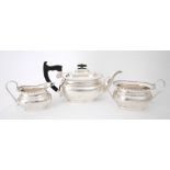 Mid-20th century silver tea service. A three-piece silver tea-service, the gadrooned rim over oblong